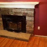 Fireplace stone work and hardwood flooring